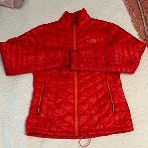 Burnt orange north face puffer zip up